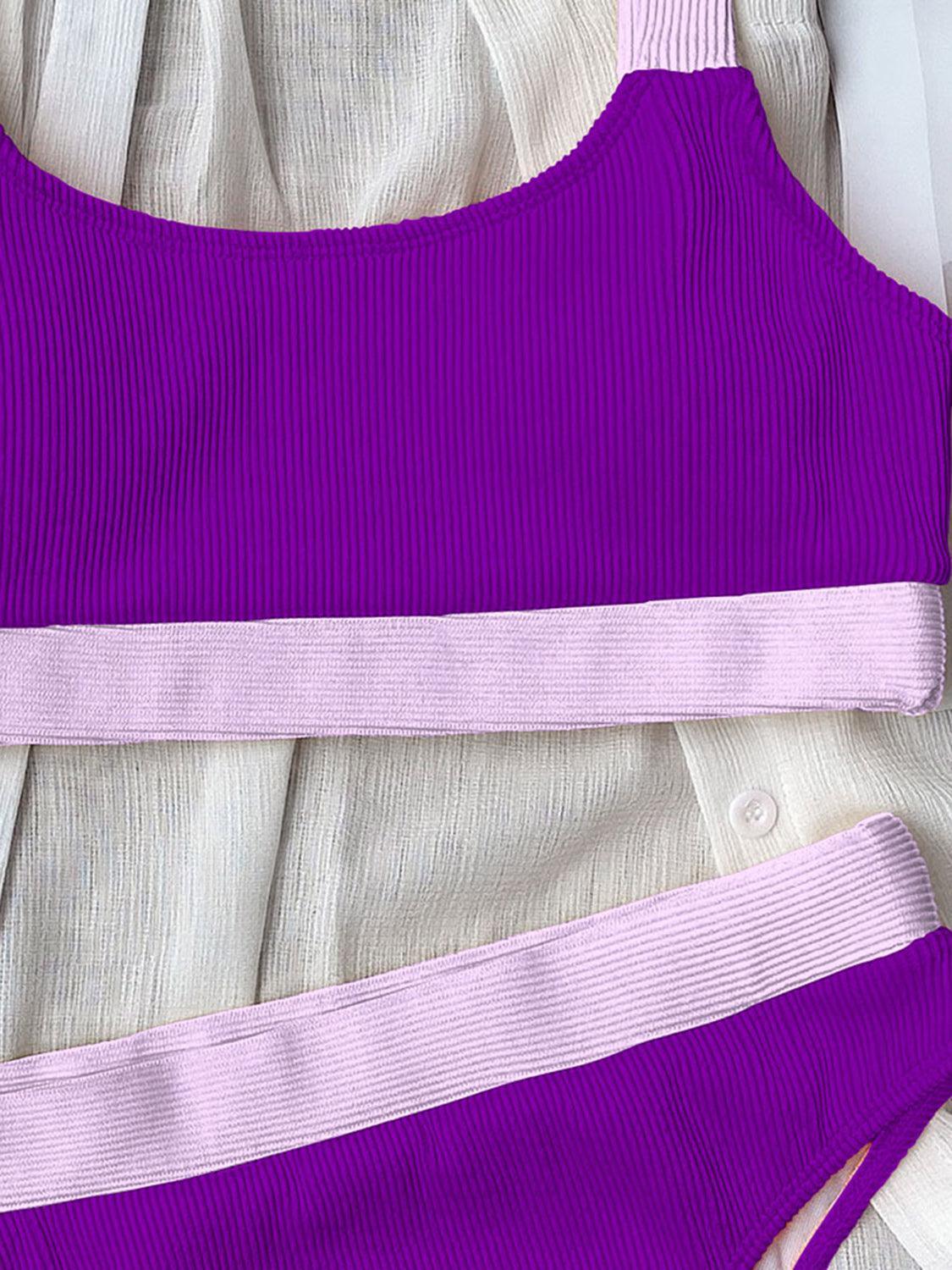 a close up of a purple and white top