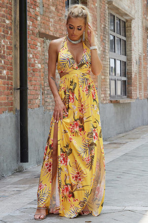 a woman in a yellow dress is walking down the street