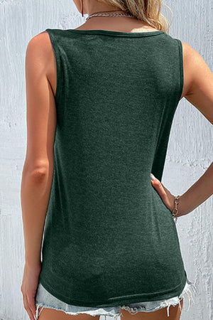 a woman wearing a green tank top