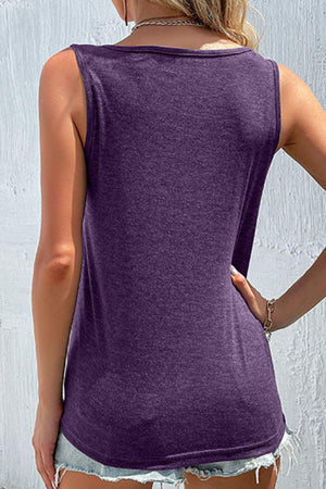 a woman wearing a purple tank top