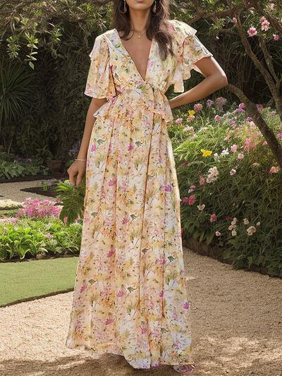 a woman standing in a garden wearing a dress