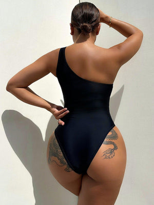 a woman in a black one piece swimsuit