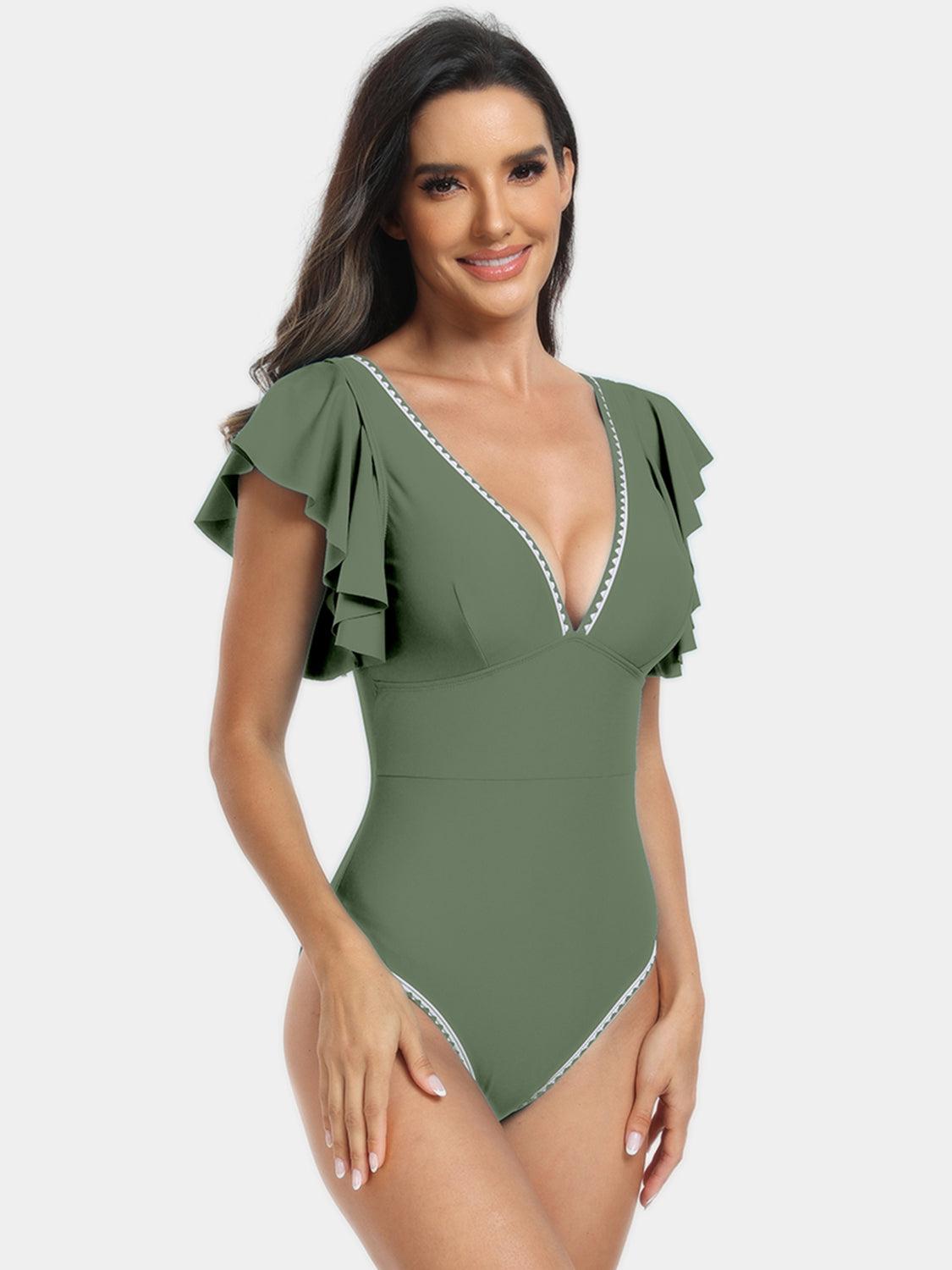 a woman in a green one piece swimsuit