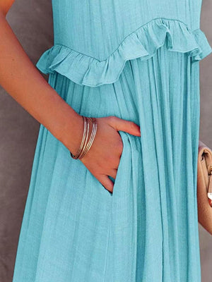 a woman in a blue dress holding a purse