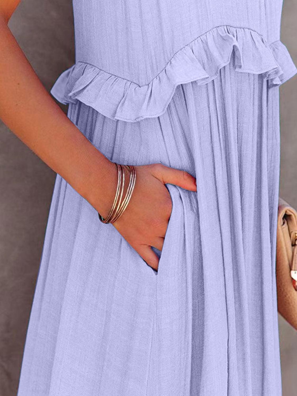 a woman in a blue dress holding a purse