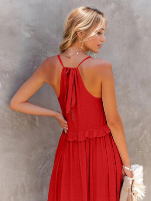 a woman wearing a red dress and holding a white purse