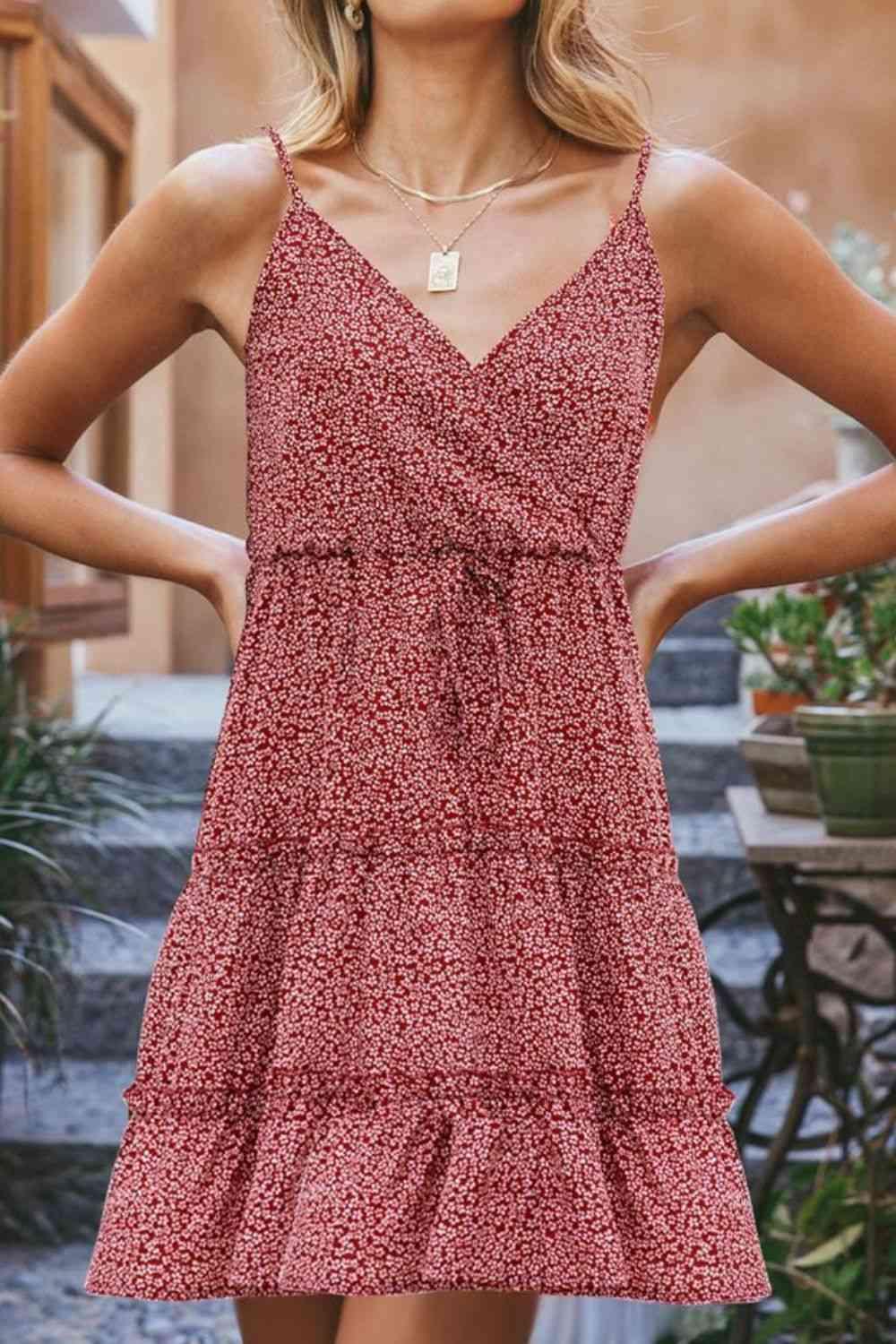 a woman wearing a red floral dress