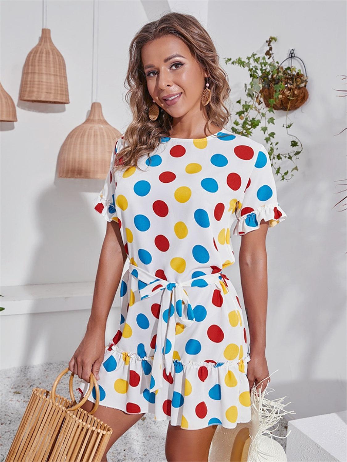 a woman in a polka dot dress holding a basket
