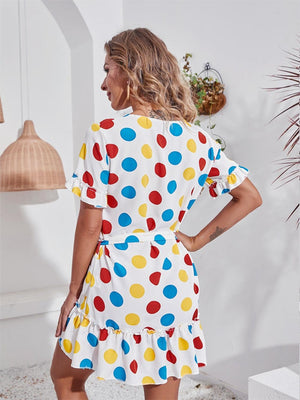 a woman in a polka dot print dress
