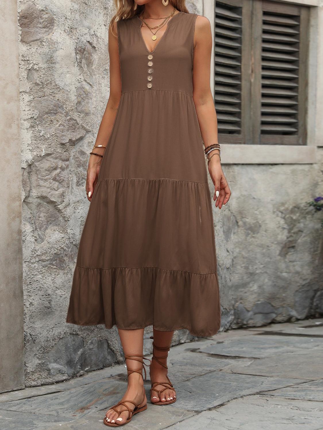 a woman wearing a brown dress and sandals