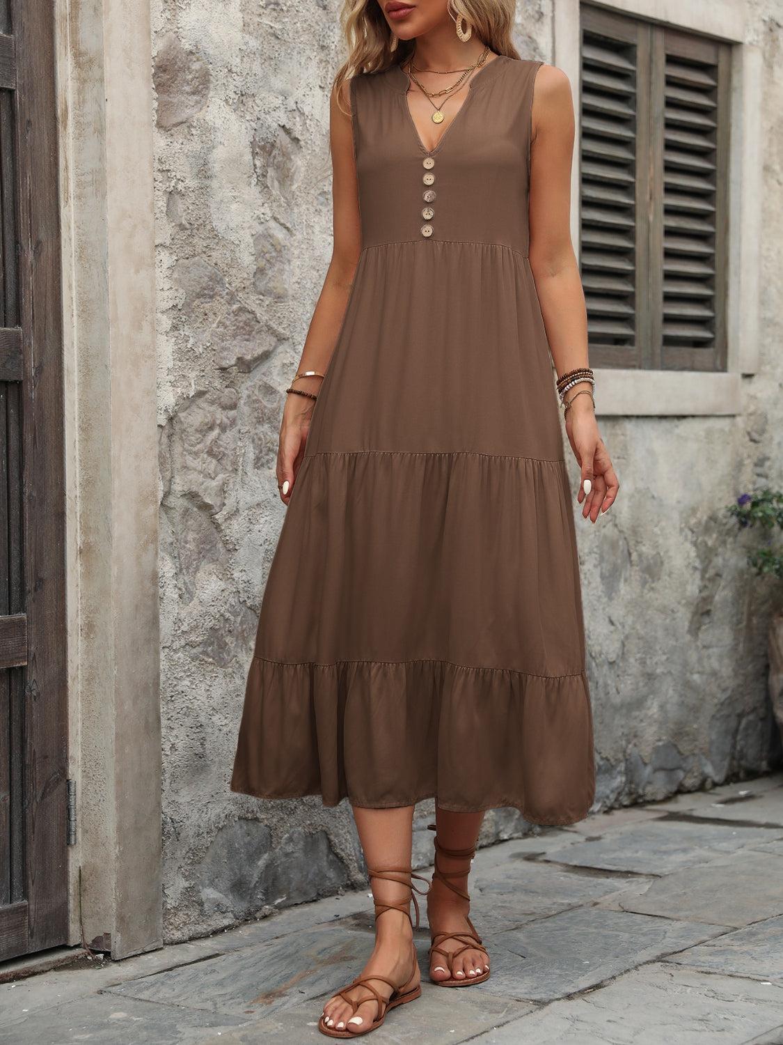 a woman wearing a brown dress and sandals