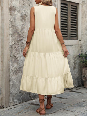 a woman in a white dress standing in front of a stone building