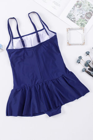 a blue dress with a white top and a pair of scissors