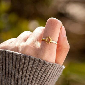 a woman's hand with a ring on it