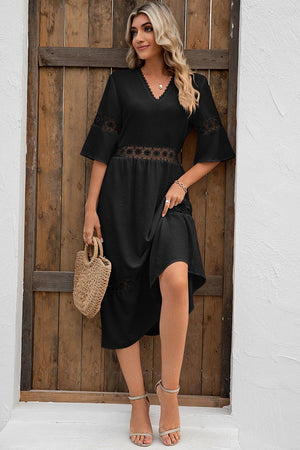 a woman standing in front of a wooden door