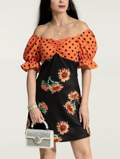 a woman wearing a dress with sunflowers on it