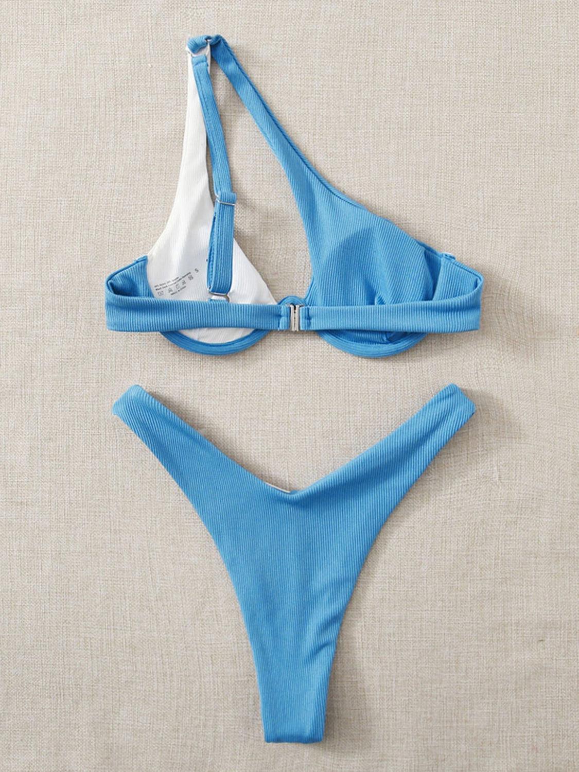 a blue and white bikini top and a white bikini bottom
