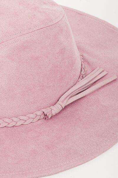 a close up of a pink hat on a white surface