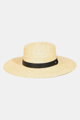 a white hat with a black ribbon around the brim
