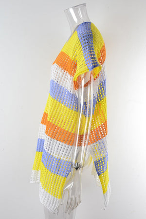 a white mannequin wearing a yellow and blue striped jacket