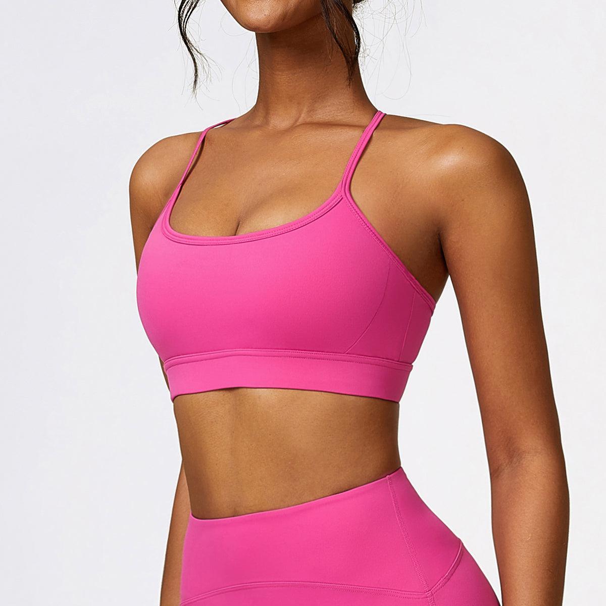 a woman in a pink sports bra top