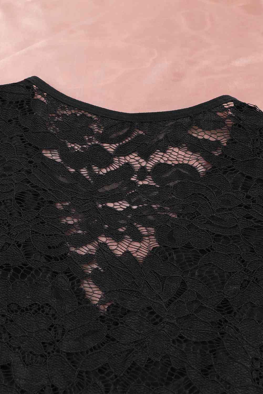 a close up of a black lace top