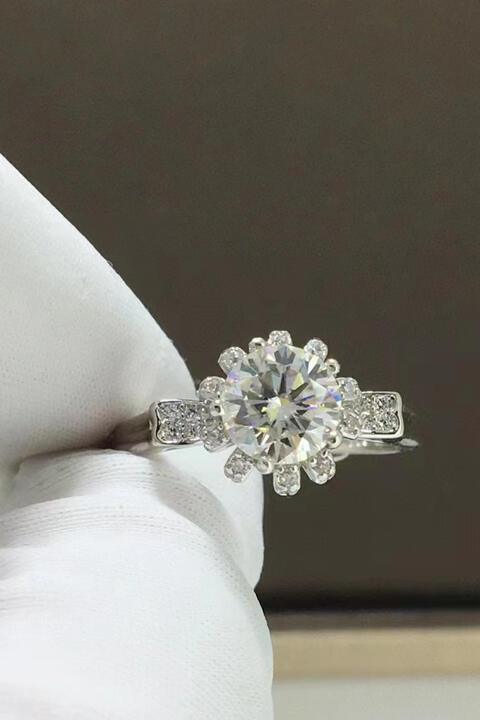 a diamond engagement ring on a white napkin