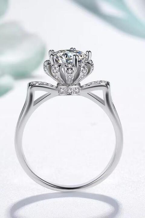 a white gold ring with a diamond center