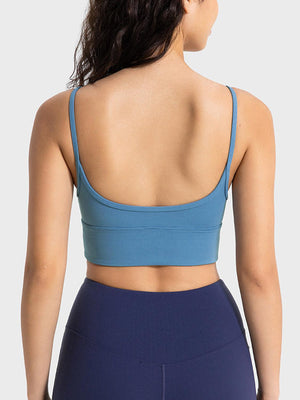 a woman wearing a blue sports bra top