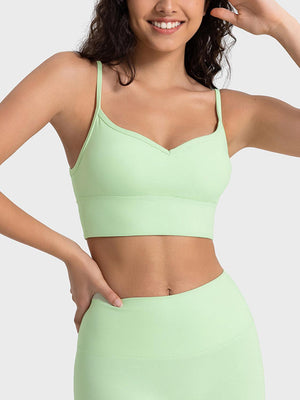 a woman in a light green sports bra top