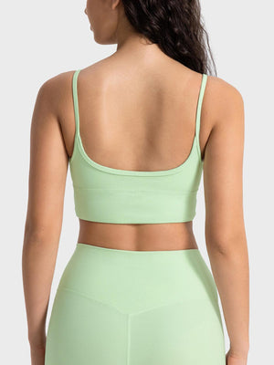 a woman in a light green sports bra top