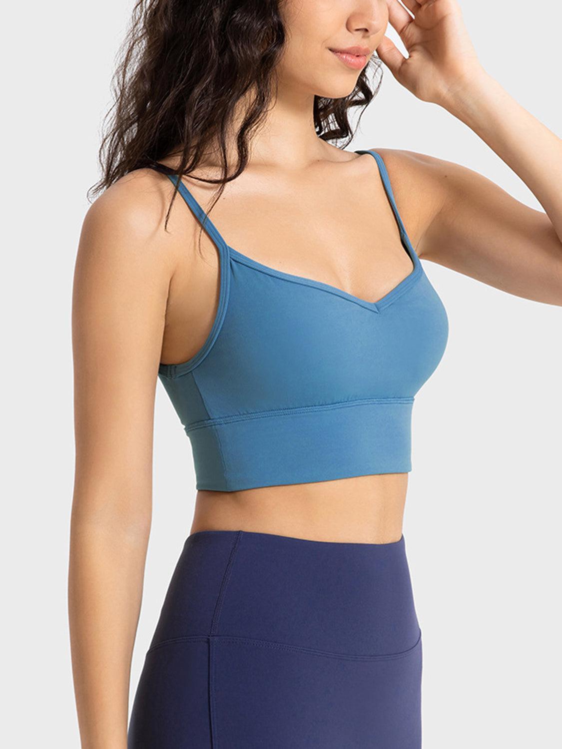 a woman wearing a blue sports bra top