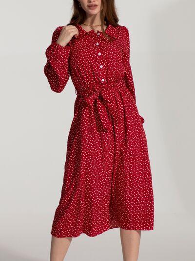 a woman in a red polka dot dress