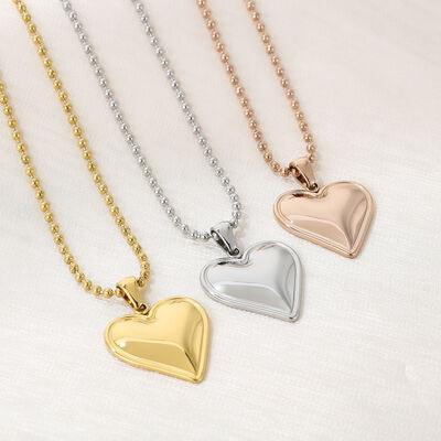 three heart shaped pendants on a chain