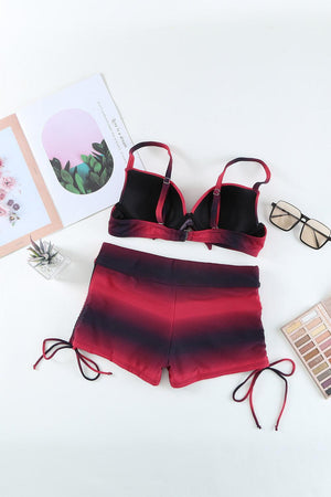 a red and black bikini top and matching shorts