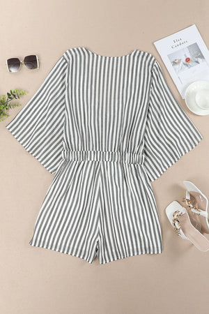 a pair of shoes, sunglasses, and a striped romper