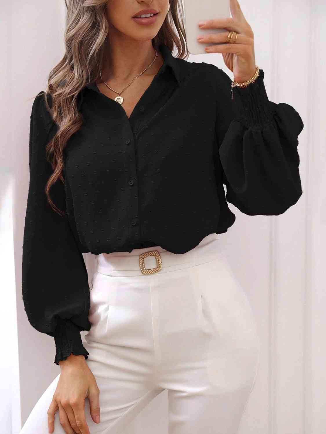 a woman wearing a black shirt and white pants