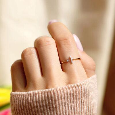 a woman's hand with a diamond ring on it