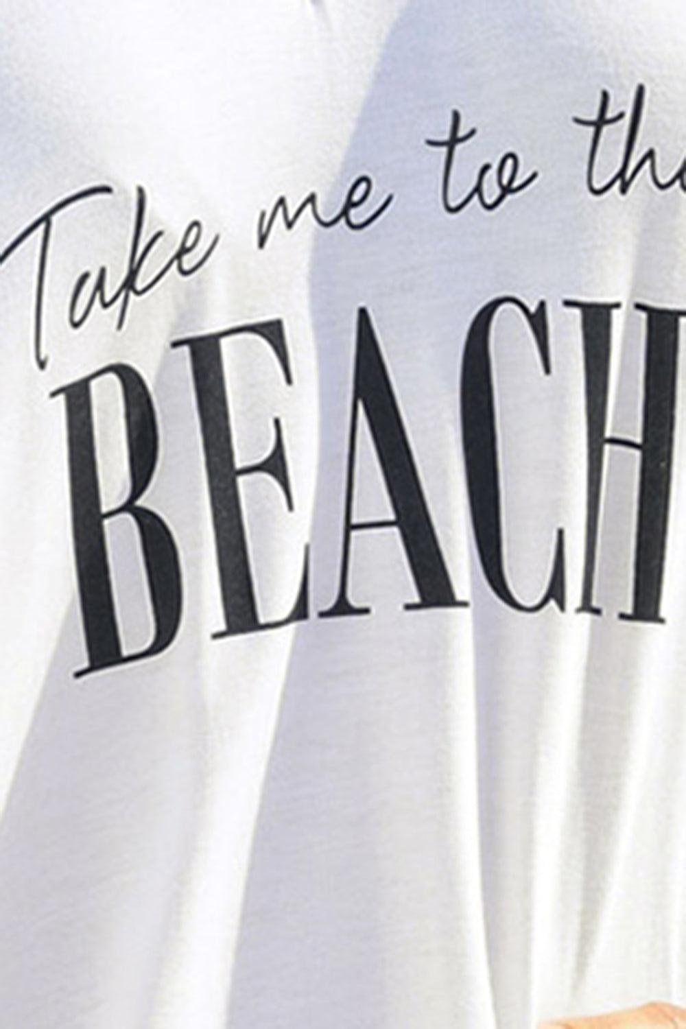 a person wearing a white shirt that says take me to the beach