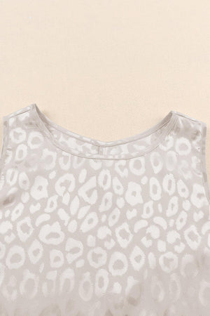 a white top with a leopard print on it