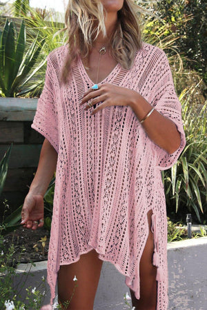a woman wearing a pink crochet cover up