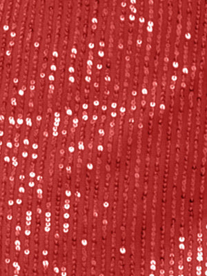 a red sequinized fabric background