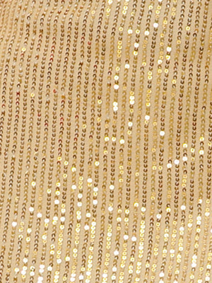 a close up of a gold sequined fabric