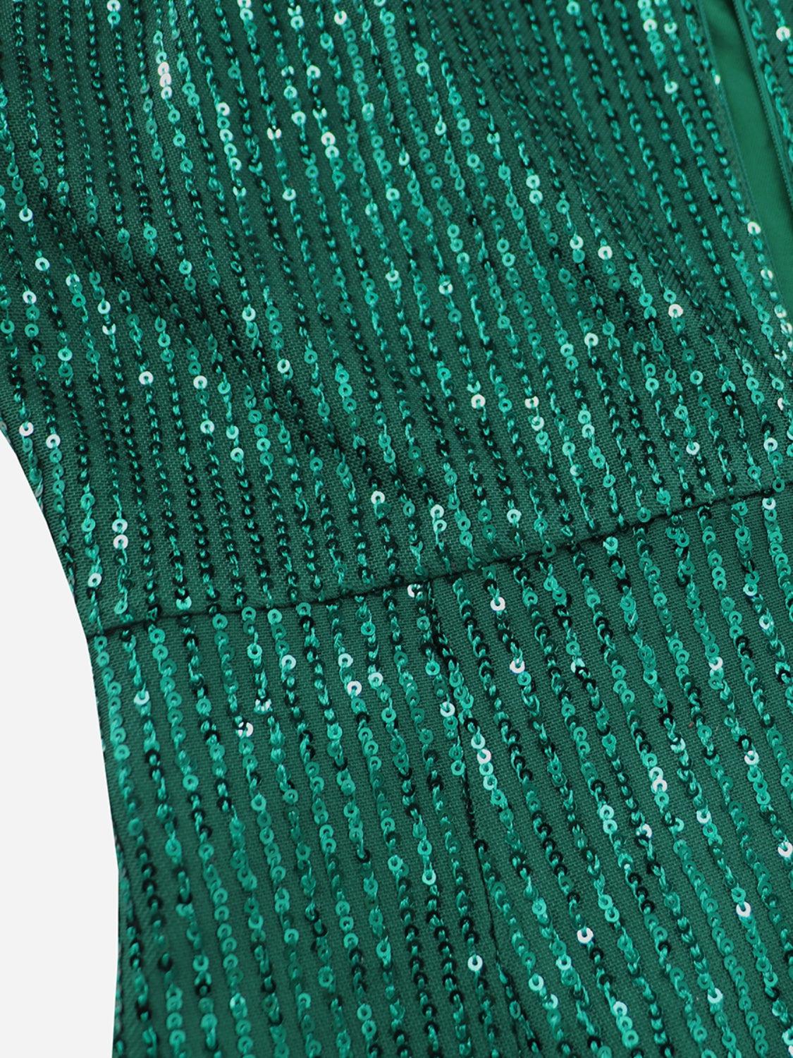 a close up of a green dress with sequins