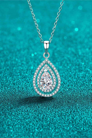 a necklace with a tear shaped diamond on it