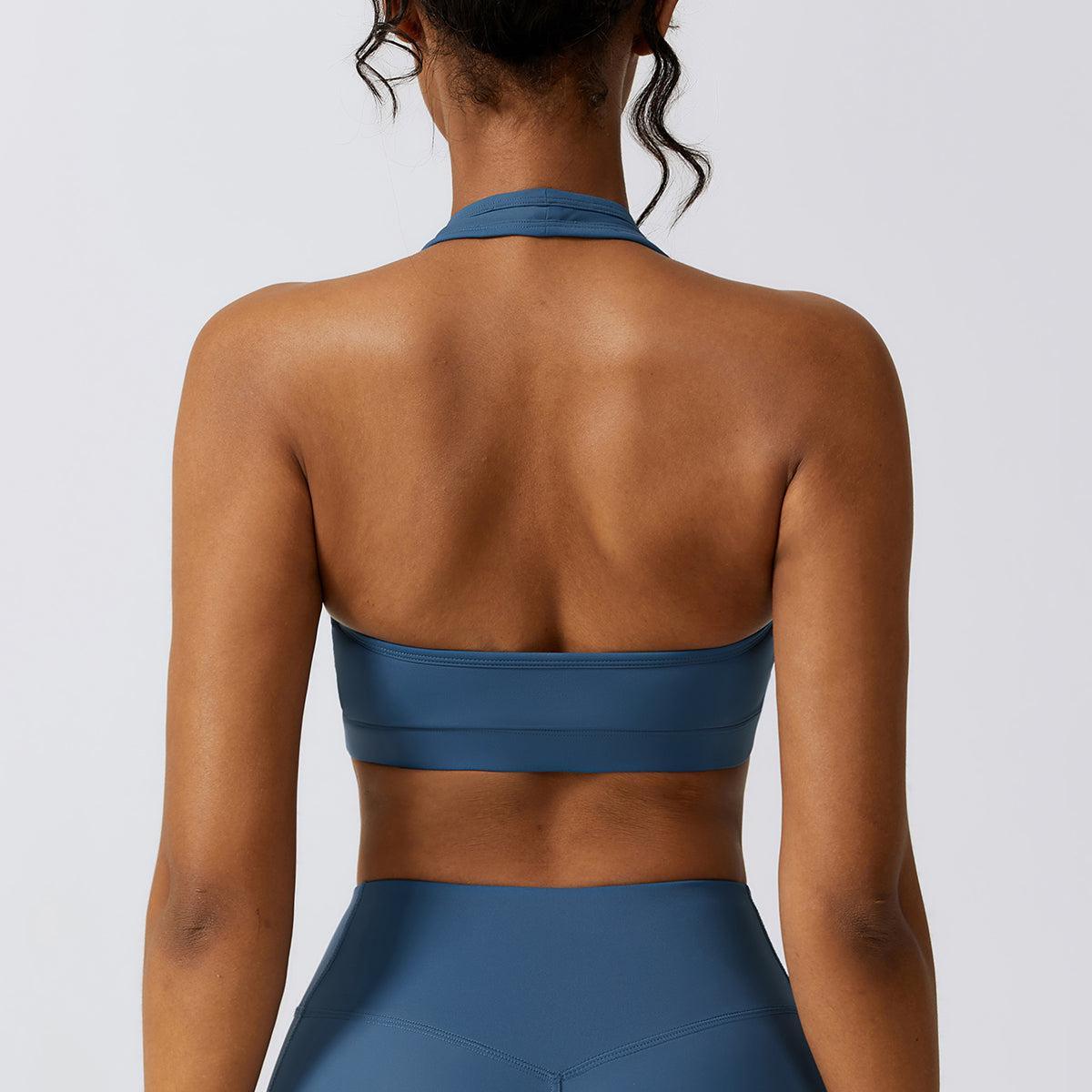 the back of a woman wearing a blue sports bra
