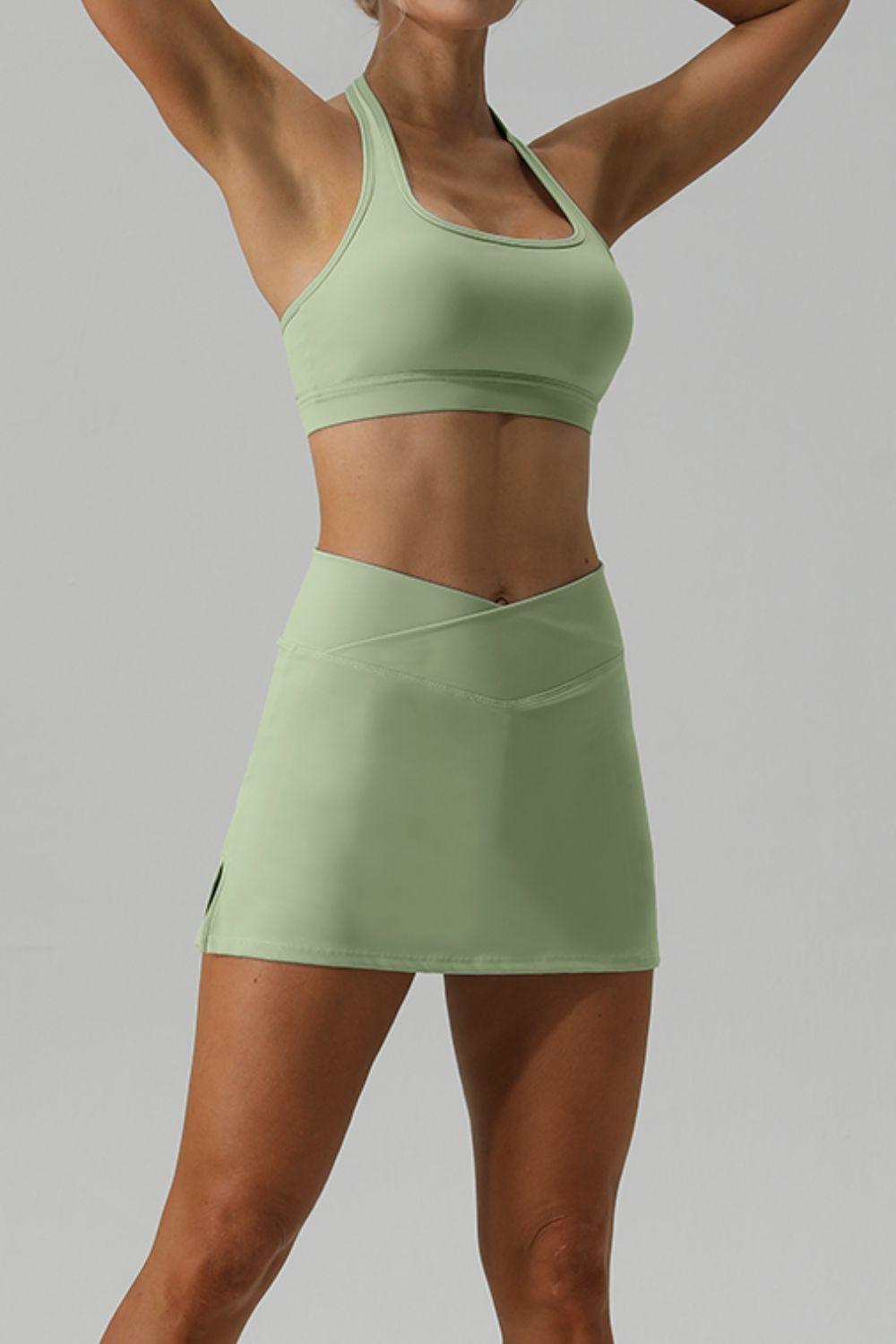 a woman in a short skirt and sports bra top