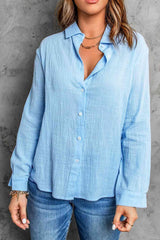 a woman wearing a blue shirt and jeans