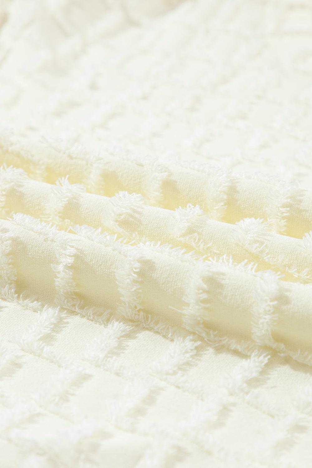 a close up of a white quilted material