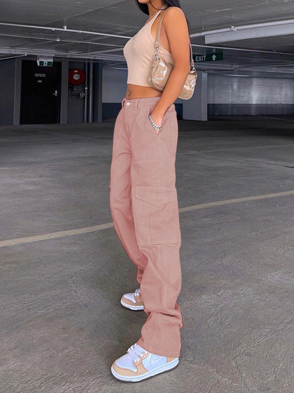 a woman standing in an empty parking garage